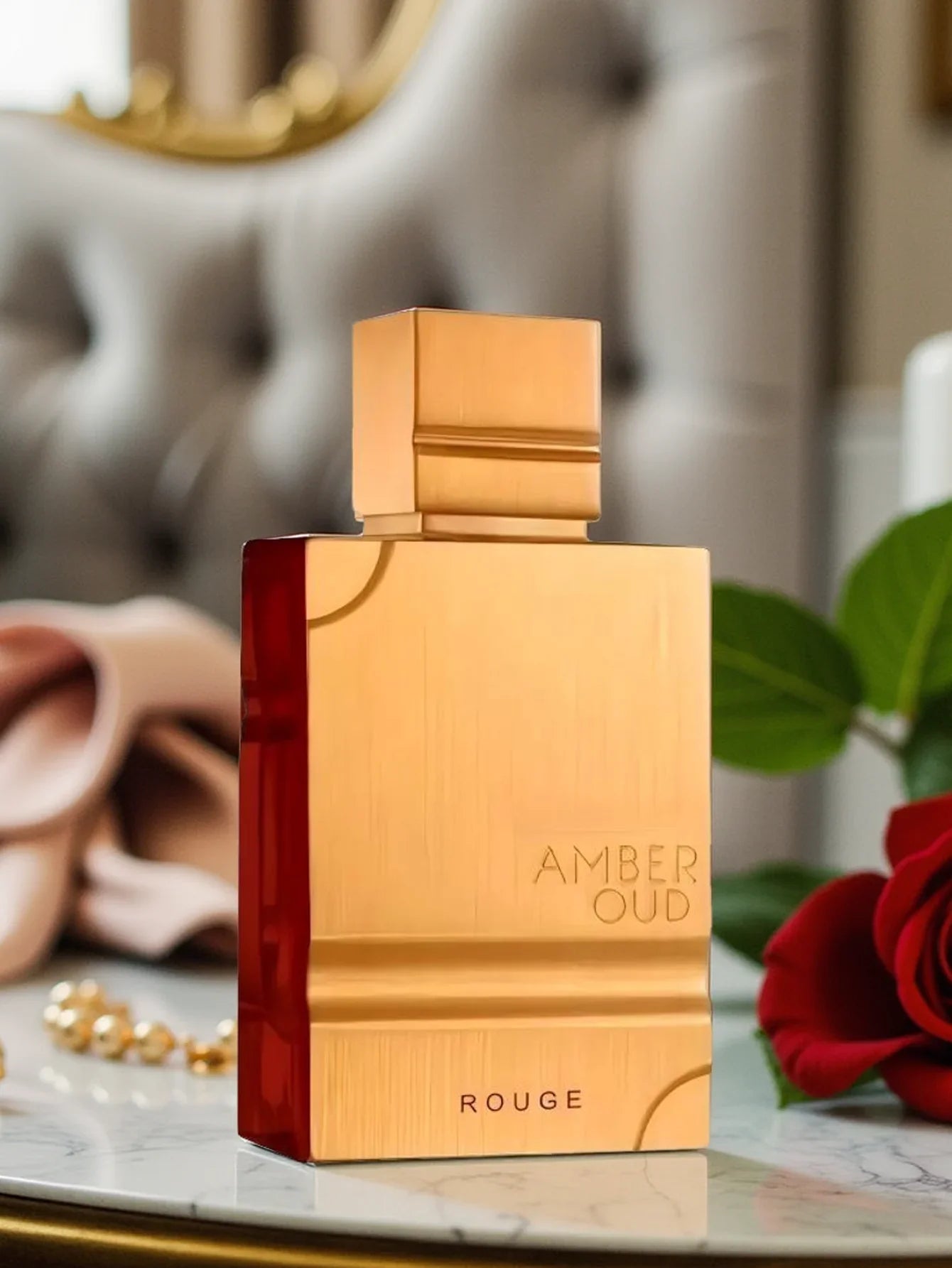 Unisex Al Haramain Amber Oud Rouge Eau de Parfum 60ml bottle with floral amber scent, sleek glass design.