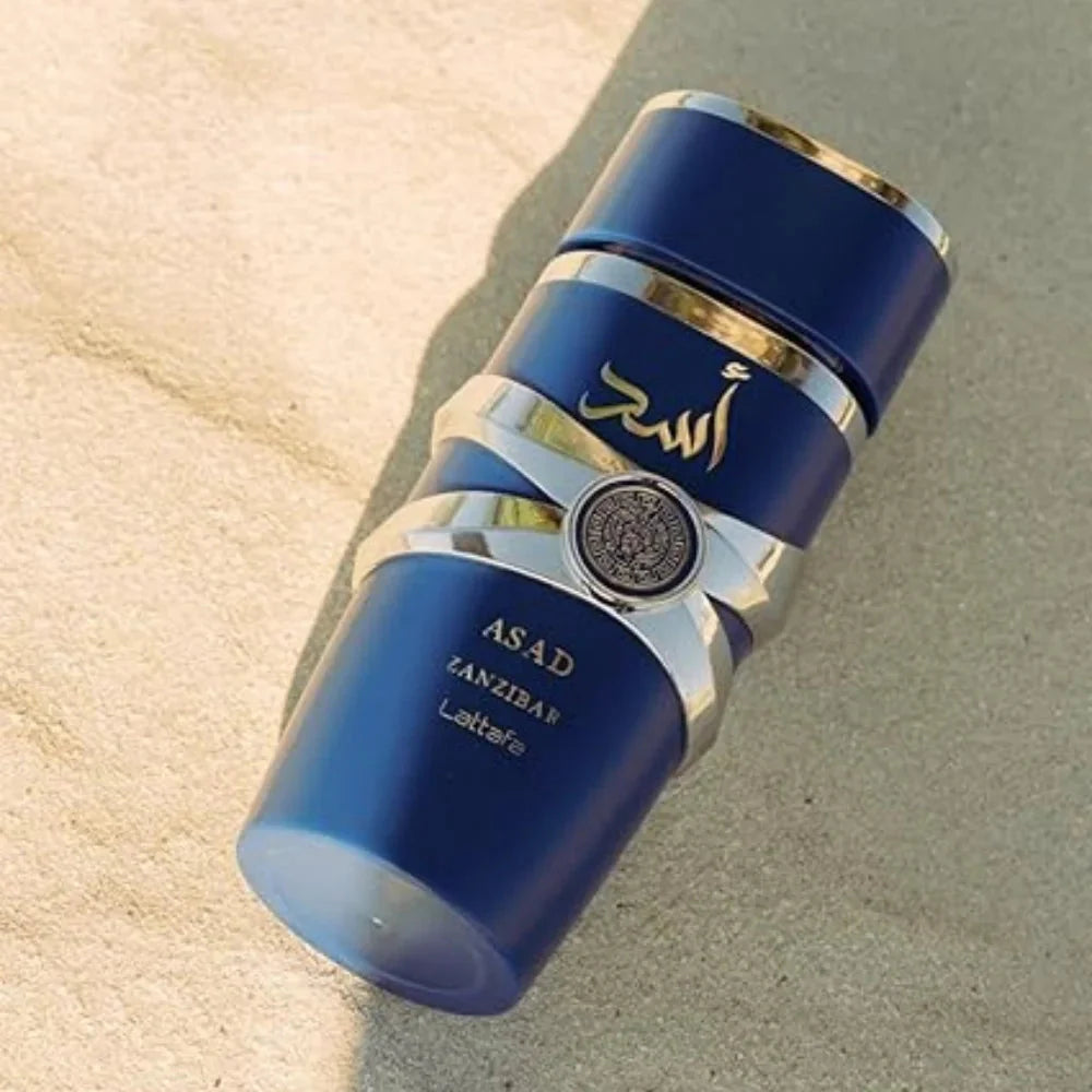 Lattafa Asad Zanzibar Blue Edition men's Eau de Parfum spray in 3.4 oz bottle, featuring a sleek design and blue accents.