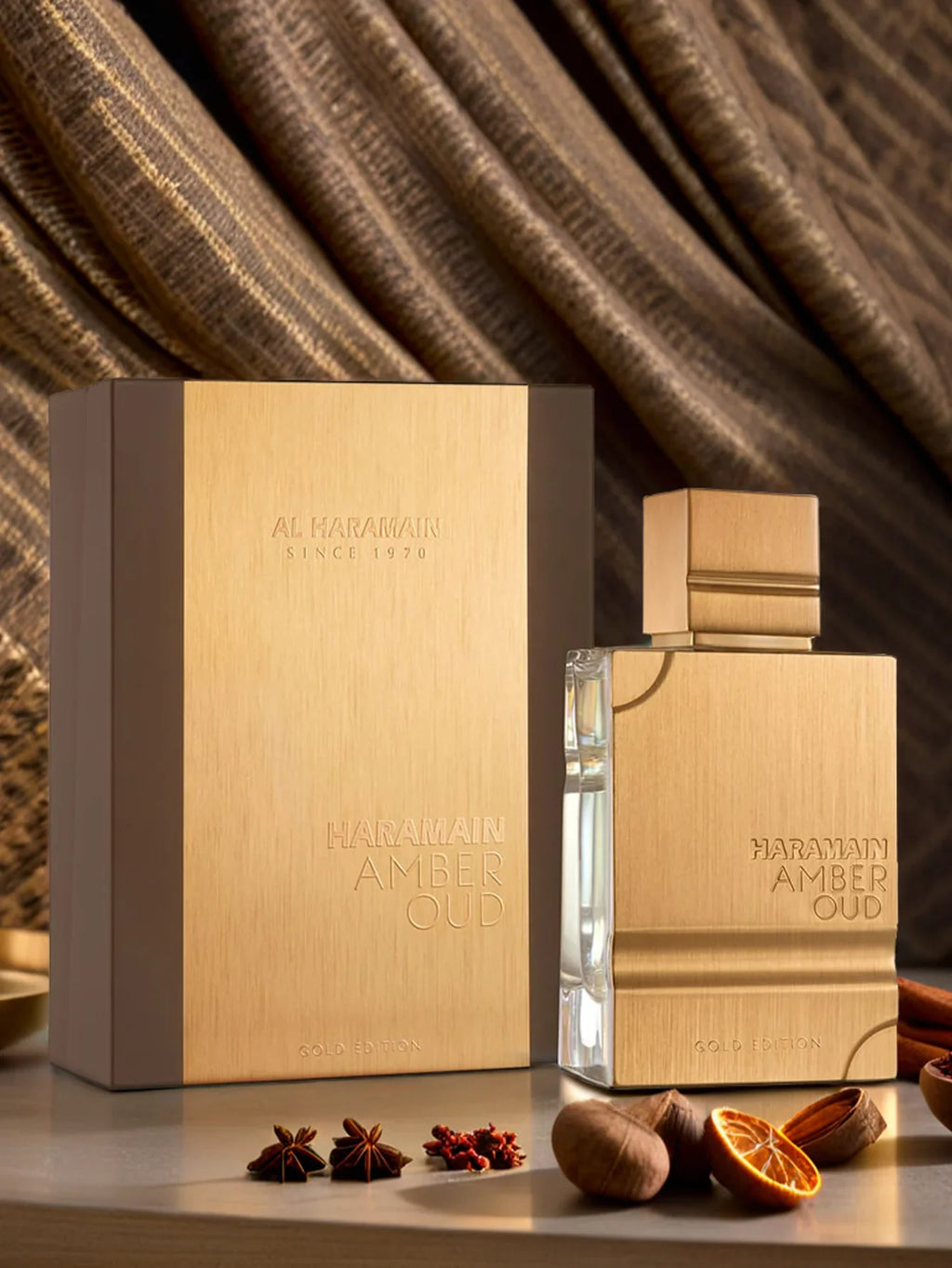 Haramain Gold Edition luxury perfume bottle with amber and oud scent, 60ml, showcasing elegant packaging and gold accents.