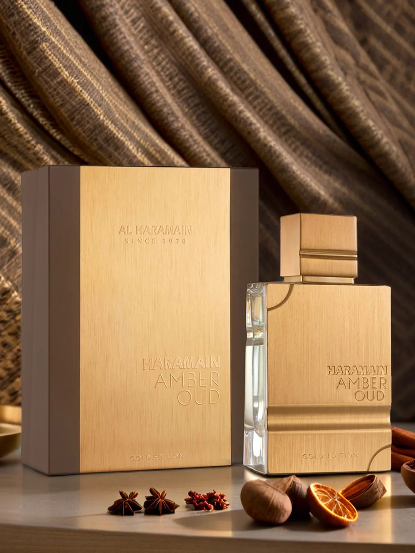 Haramain Gold Edition luxury perfume bottle with amber and oud scent, 60ml, showcasing elegant packaging and gold accents.