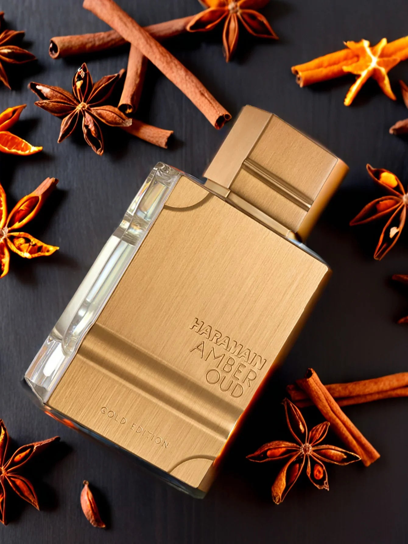 Haramain Gold Edition luxury amber and oud perfume bottle, 60ml, elegant glass design with gold accents, showcasing opulence and sophistication