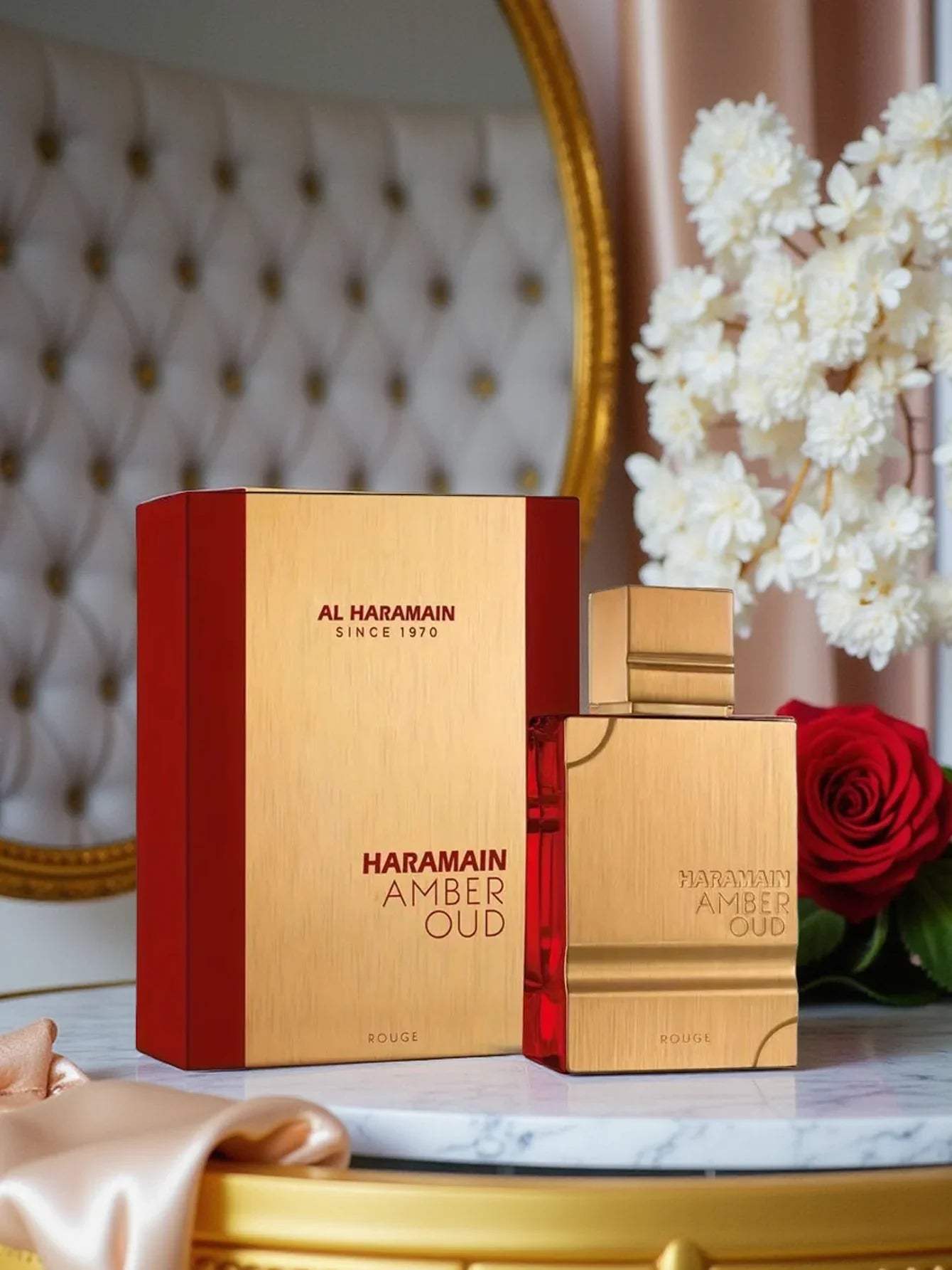 Al Haramain Amber Oud Rouge Eau de Parfum for unisex, 60ml bottle with amber floral scent and elegant glass design.