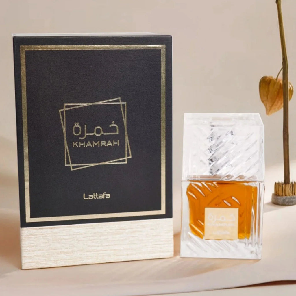 Lattafa Khamrah EDP unisex spicy vanilla perfume spray in 3.4 oz bottle with elegant design and spray nozzle.