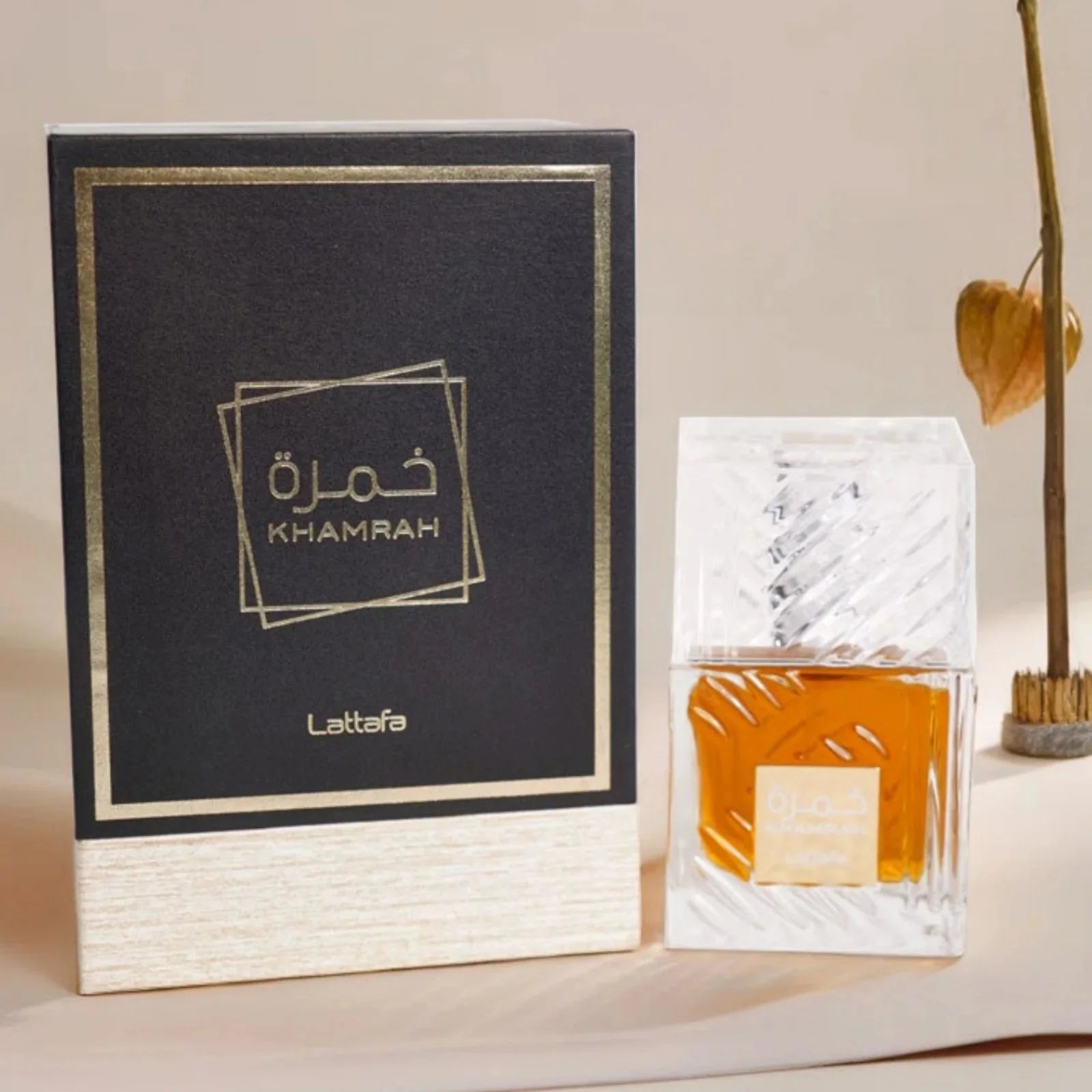 Lattafa Khamrah EDP unisex spicy vanilla perfume spray in 3.4 oz bottle with elegant design and spray nozzle.