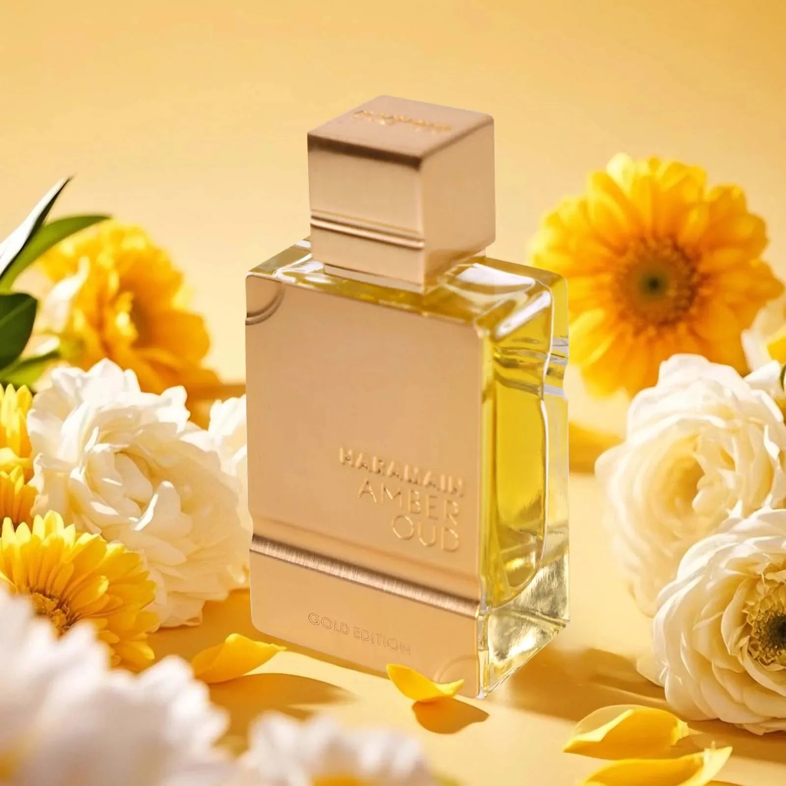 Unisex Al Haramain Gold Eau De Parfum bottle with amber and vanilla notes, 2oz, featuring gold accents and elegant packaging