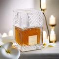 Unisex Lattafa Khamrah EDP perfume spray with spicy vanilla scent in a 3.4 oz bottle, featuring elegant packaging and design