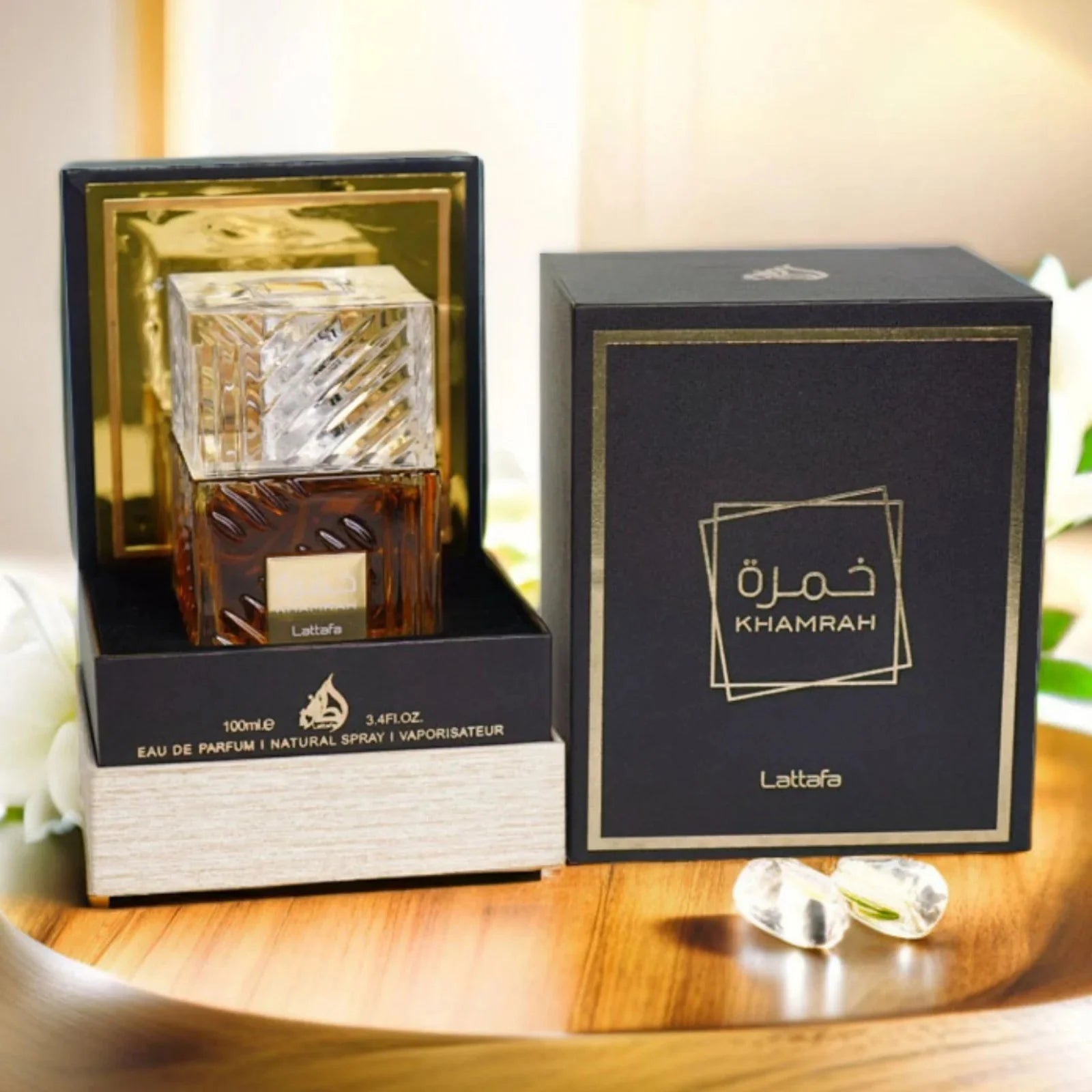 Lattafa Khamrah EDP unisex spicy vanilla perfume spray, 3.4 oz, with elegant bottle design and warm, inviting fragrance.