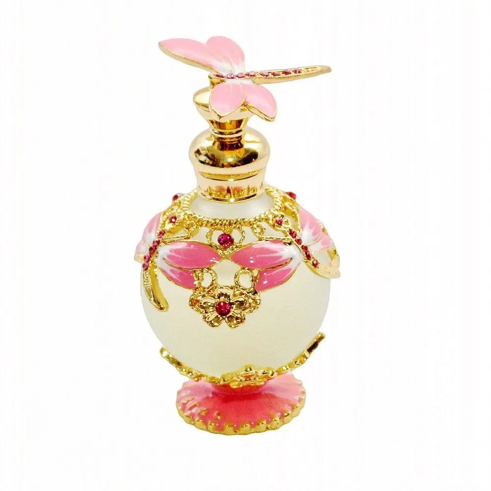 Arabian Rich Middle Eastern style essential oil perfume, "Reverses Paris True Blue," features gold and pink dragonfly designs with gemstones, a pink dragonfly stopper, and is crafted under strict quality control by expert cosmetics professionals.