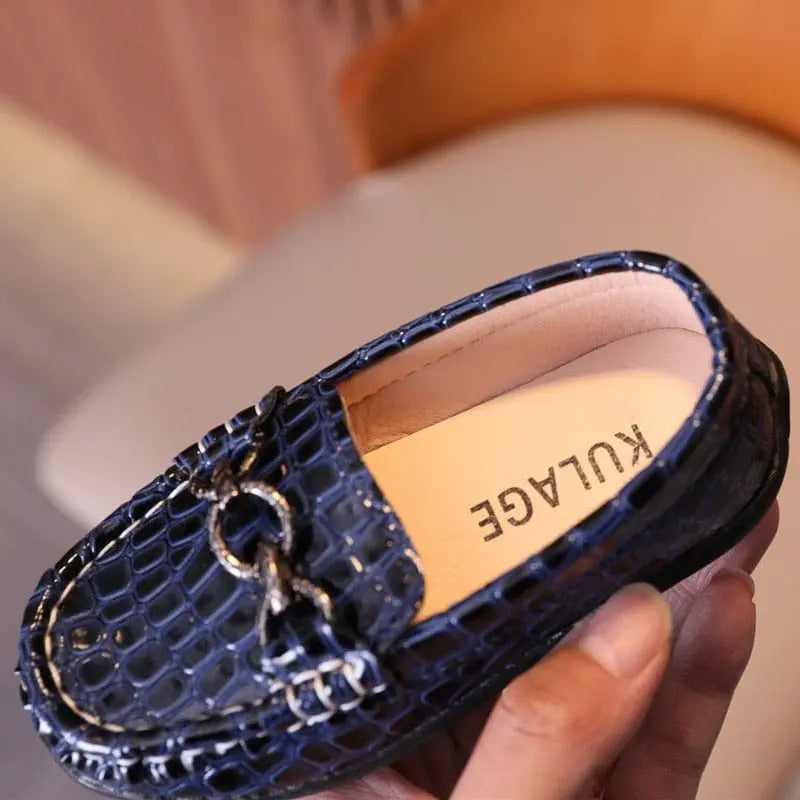 Baby boys leather loafers by Showlu Fashion Store featuring slip-on design, metal buckle, casual moccasin style for kids.