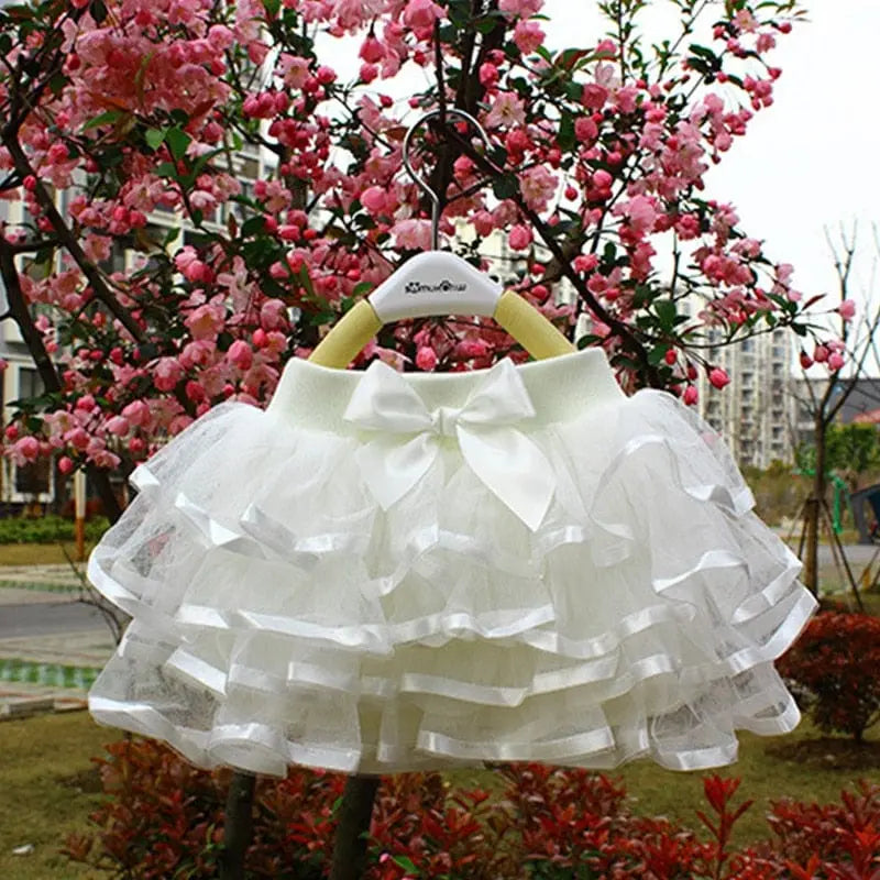 Baby girl rainbow tutu skirt from Showlu Fashion Store, featuring colorful tulle fabric for ballet and dance outfits.