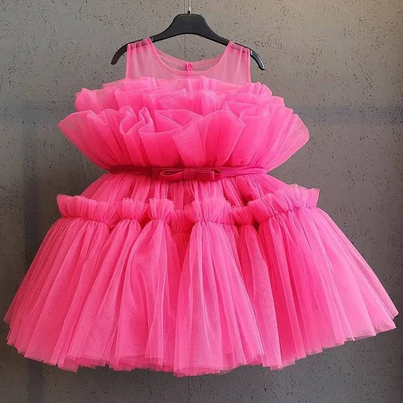 Baby girl floral tulle ball gown by Showlu Fashion Store, sleeveless, elegant dress for birthday, baptism, or formal occasions.