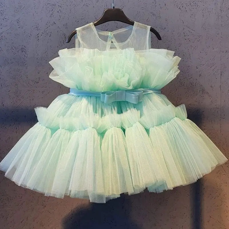Baby girl floral tulle ball gown by Showlu Fashion for birthday, baptism, or formal occasions, featuring sleeveless design and elegant floral details.