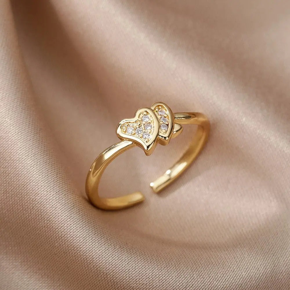 Adjustable stainless steel bee and butterfly ring with cubic zirconia accents, featuring a moon and heart design for women.