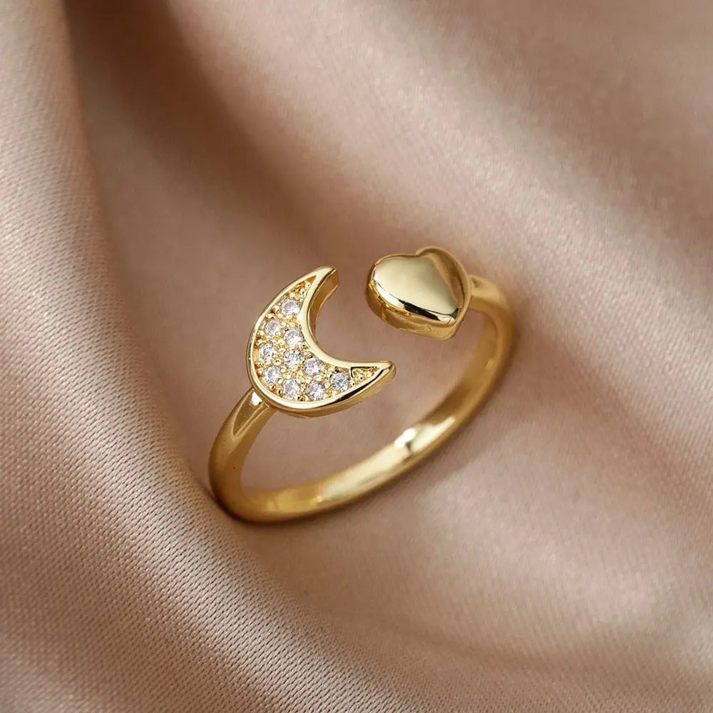 Adjustable stainless steel bee and butterfly ring with cubic zirconia accents, featuring moon and heart designs for women.