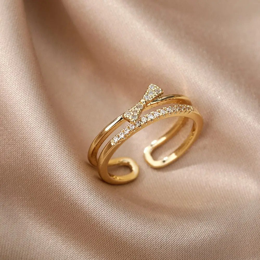 Elegant adjustable stainless steel bee and butterfly ring with cubic zirconia for women, featuring moon and heart designs.