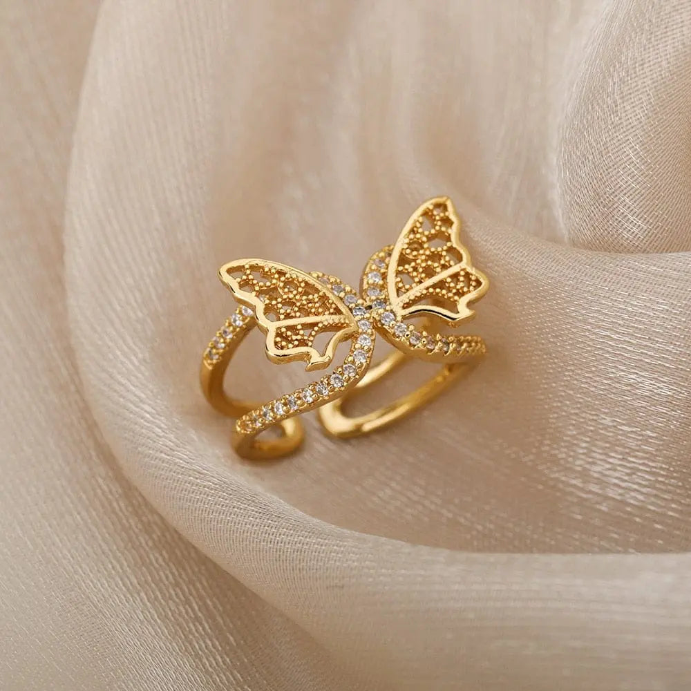 Adjustable stainless steel bee and butterfly ring with cubic zirconia accents, featuring moon and heart details for women.