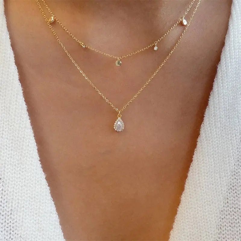 Gold boho multilayer chain necklace with pearl, cross, and heart pendants, elegant jewelry piece by Showlu Fashion Store.