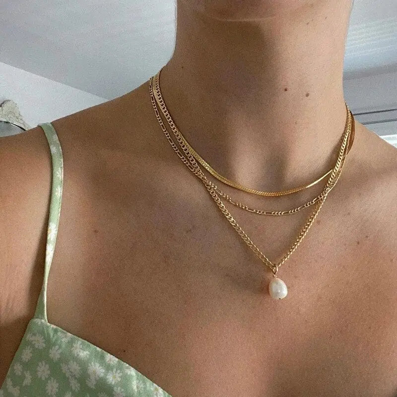 Gold boho multilayer chain necklace with pearl, cross, and heart pendants, elegant jewelry for women.