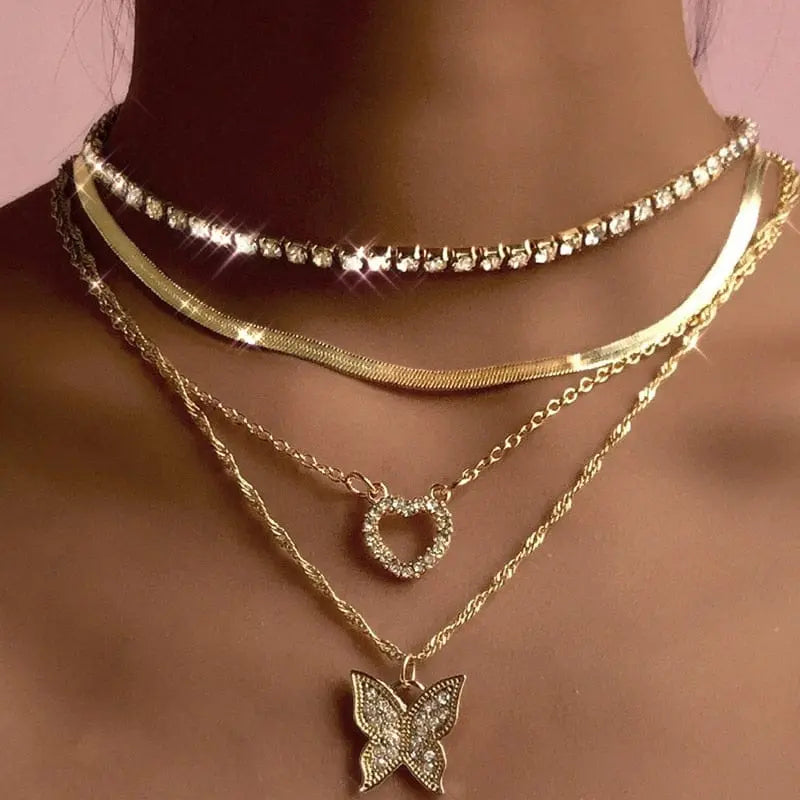 Gold boho multilayer necklace with pearl, cross, and heart pendants, featuring elegant layered chain design by Showlu Fashion Store.