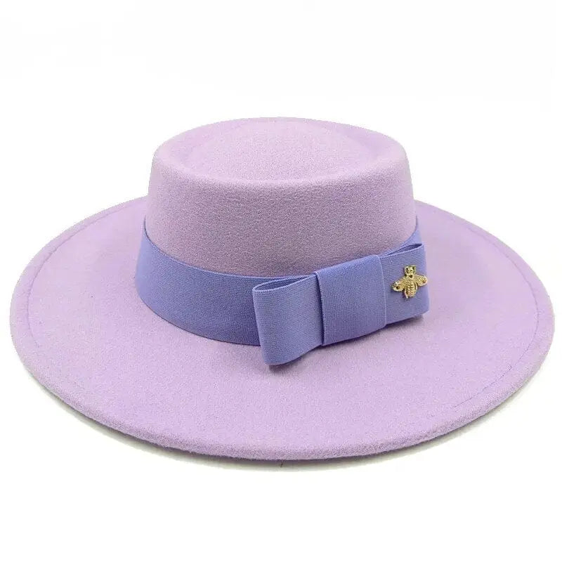 Red Showlu Fedora hat with flat top, bow tie, elastic band, and bumpy surface, suitable for men and women.