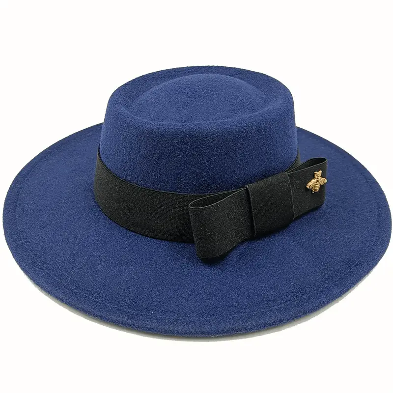 Red Showlu Fedora hat with a flat top, bow-tie detail, elastic band, and bumpy surface, suitable for men and women.