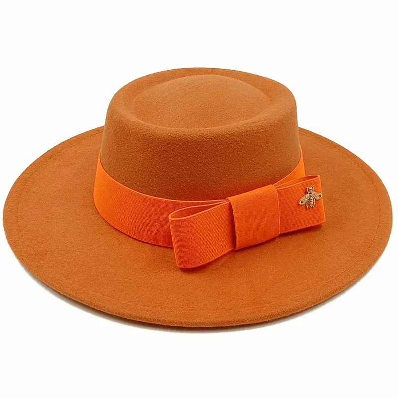 Red Showlu Fedora hat with flat top, elastic band, and bow tie, suitable for men and women, featuring a bumpy surface design.