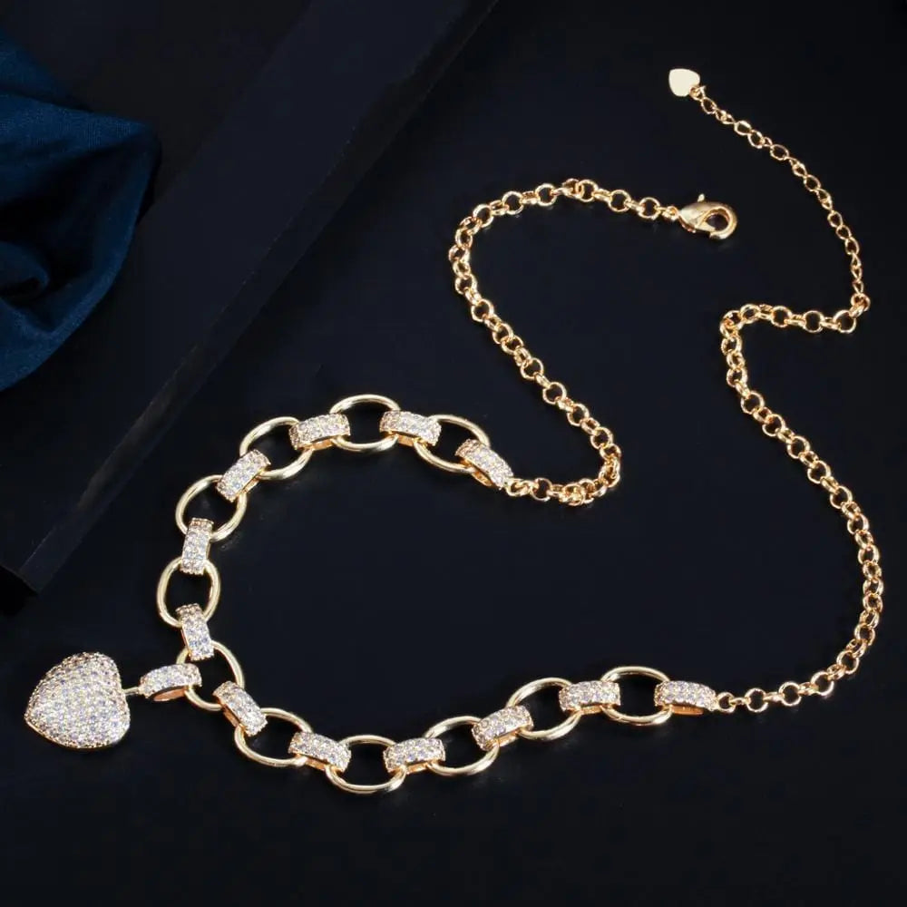 CWWZircons gold heart pendant necklace and bracelet jewelry set with cubic zirconia, elegant love-shaped charms for women.