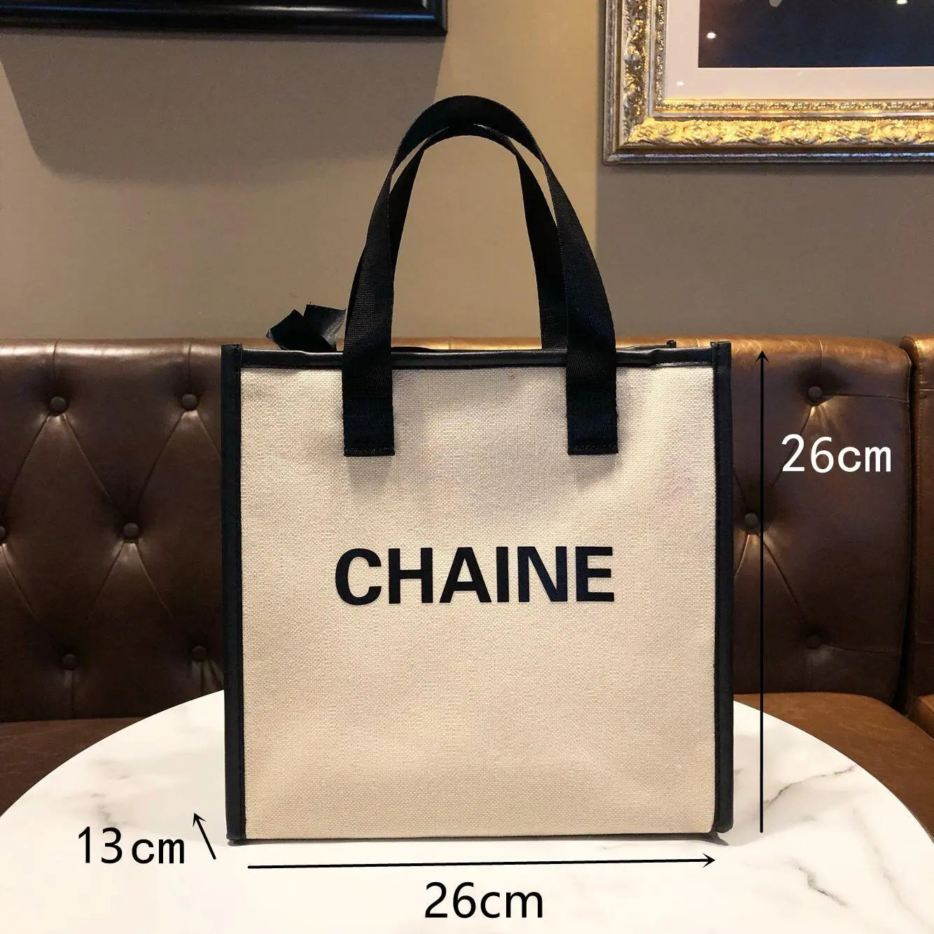 Solid color canvas tote bag by Showlu Fashion, small dumpling-style handbag suitable for office or casual use.