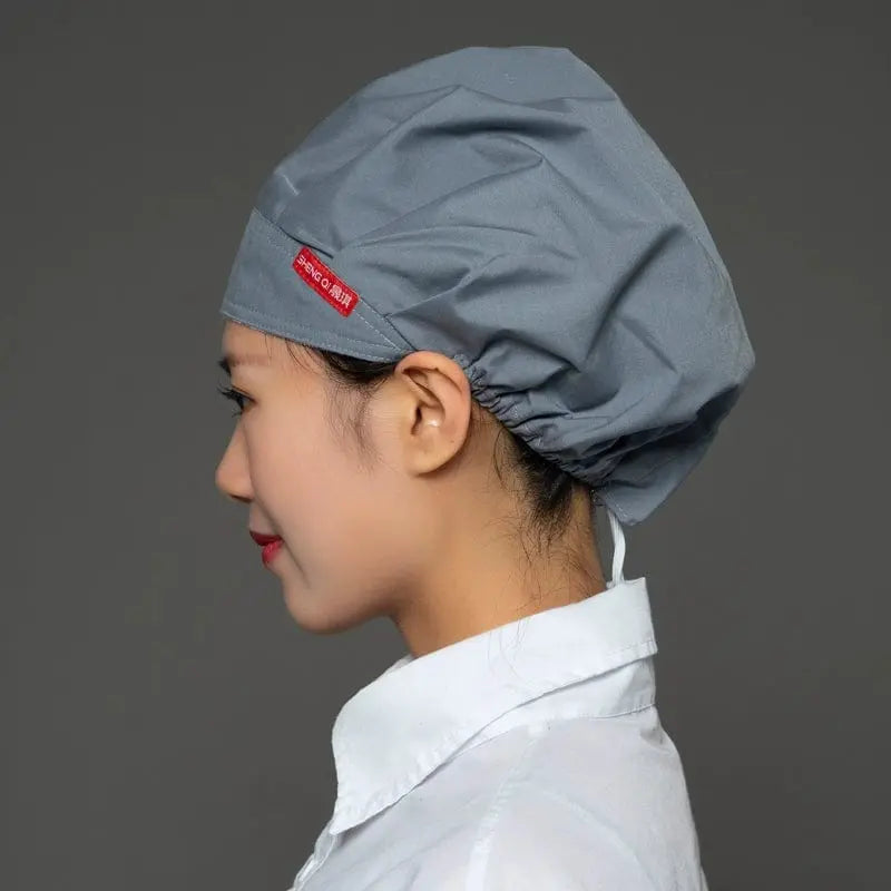 Breathable Shengqi chef cap for women, anti-smoke and hygiene cooking hat with dust protection for kitchen and catering use.
