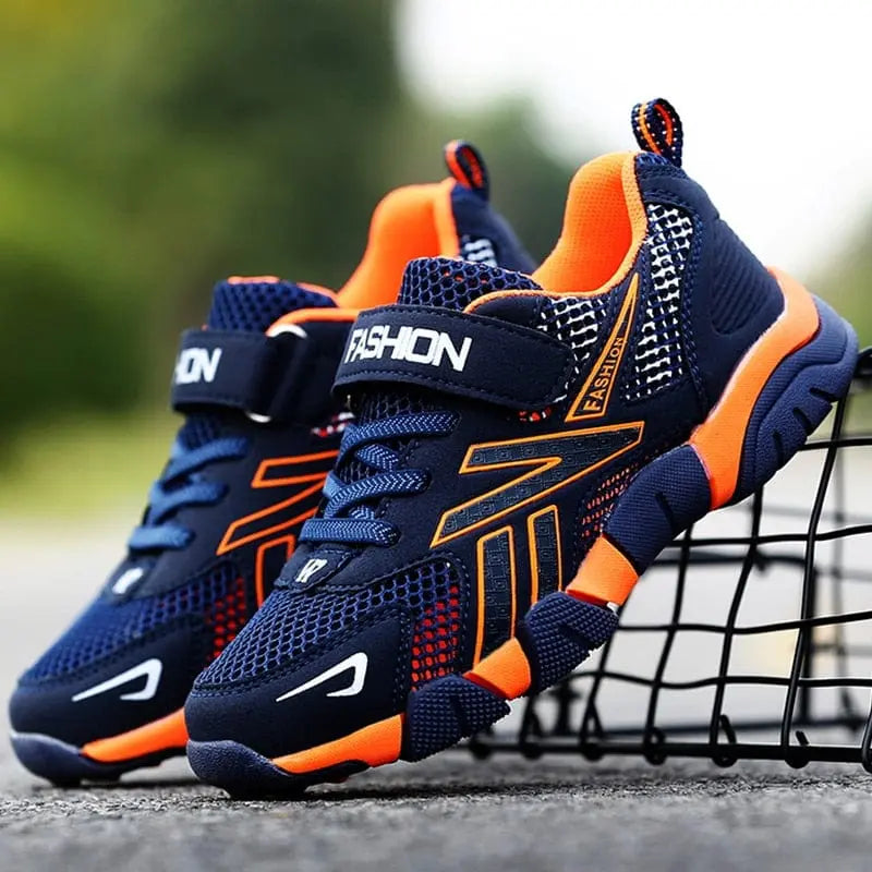 Showlu Fashion Boys mesh running shoes with breathable fabric and hook-and-loop straps, perfect for school and sports.