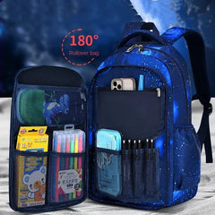 A blue galaxy-patterned children's backpack with a 180-degree opening front panel featuring multiple storage pockets.