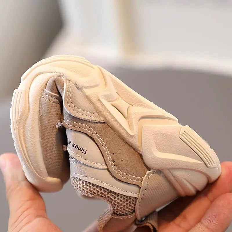 Kids breathable air mesh running shoes by Showlu Fashion Store, unisex sports sneakers with soft, breathable mesh for active play.
