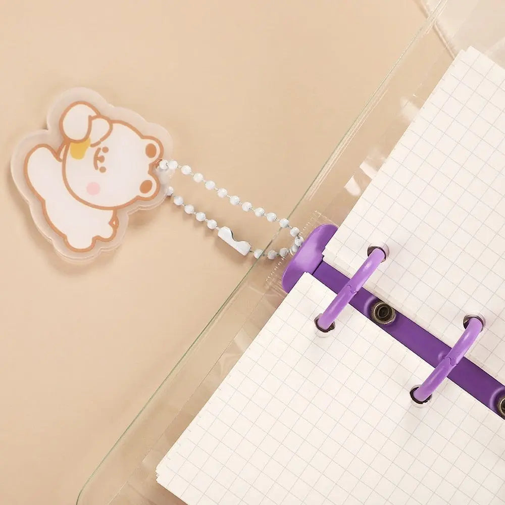 Cute transparent mini 3-ring loose-leaf notebook with kawaii design, ideal for school supplies and portable organization.