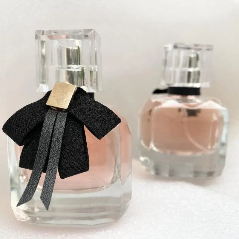Custom Showlu luxury private label women's perfume bottle with changeable design, elegant glass container for personalized fragrance.