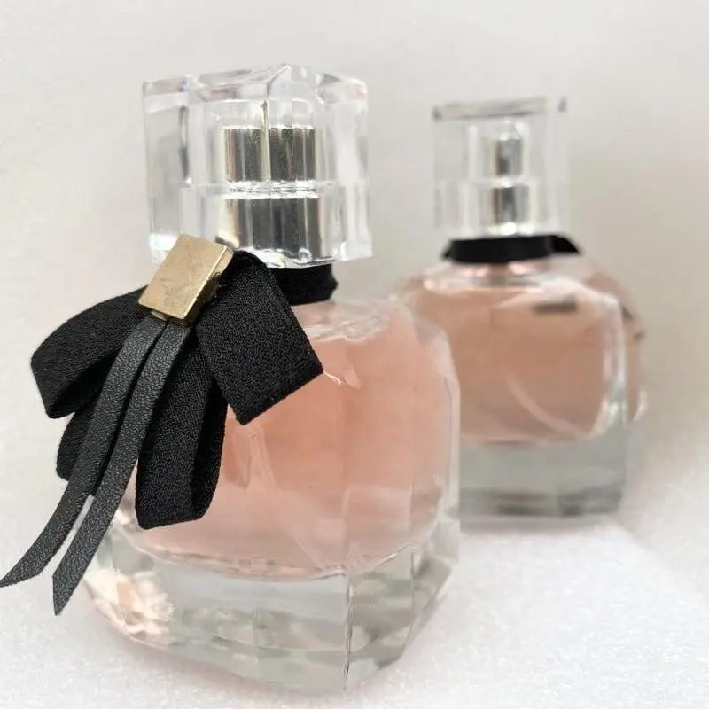 Custom luxury women's perfume bottle from Showlu Fashion Store, featuring a sleek, elegant design with changeable fragrance compartments.
