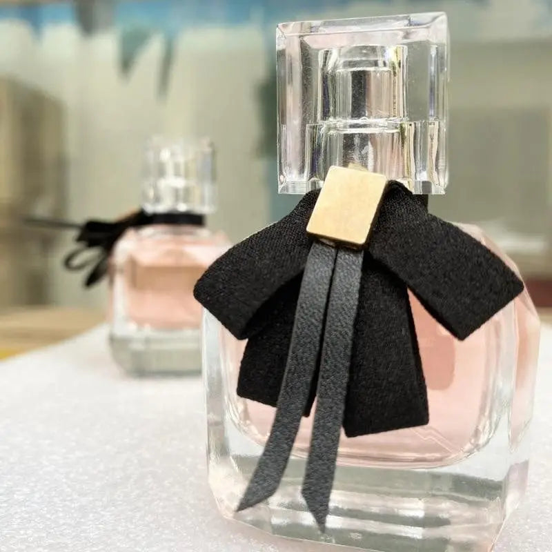 Custom luxury women's perfume bottle from Showlu Fashion Store, featuring a sleek, elegant design with a changeable fragrance cap.