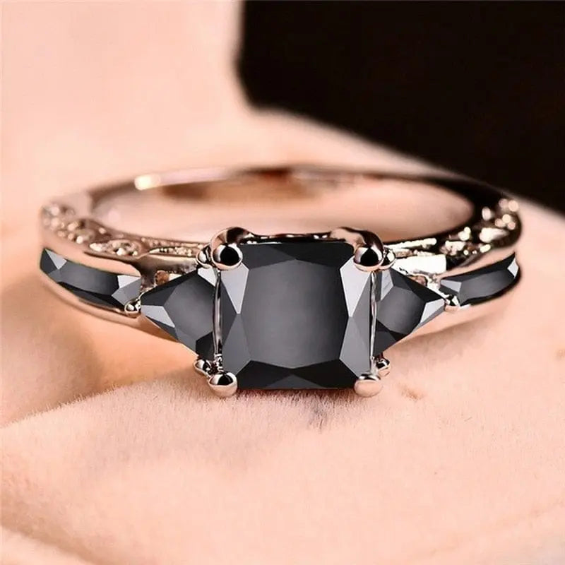 Showlu Fashion Silver Women's Princess Cut Black Zircon Wedding Ring with elegant inlaid black stones and delicate design.