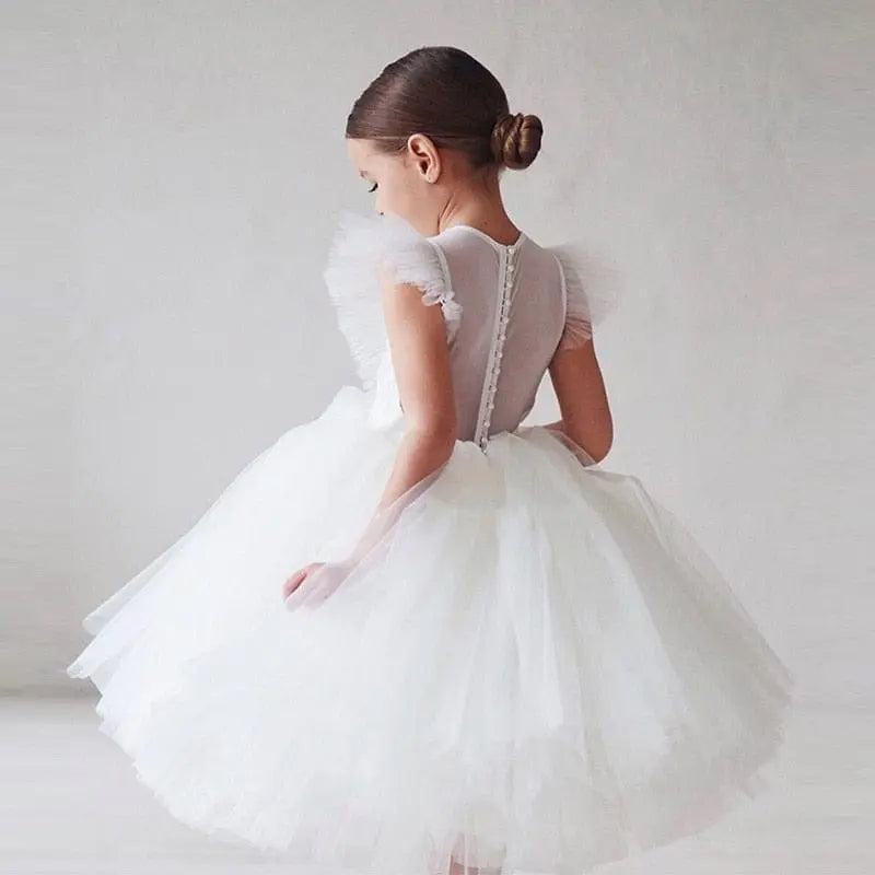 Elegant white tulle flower girl gown for kids, perfect for weddings, birthdays, and special occasions by Showlu Fashion Store.