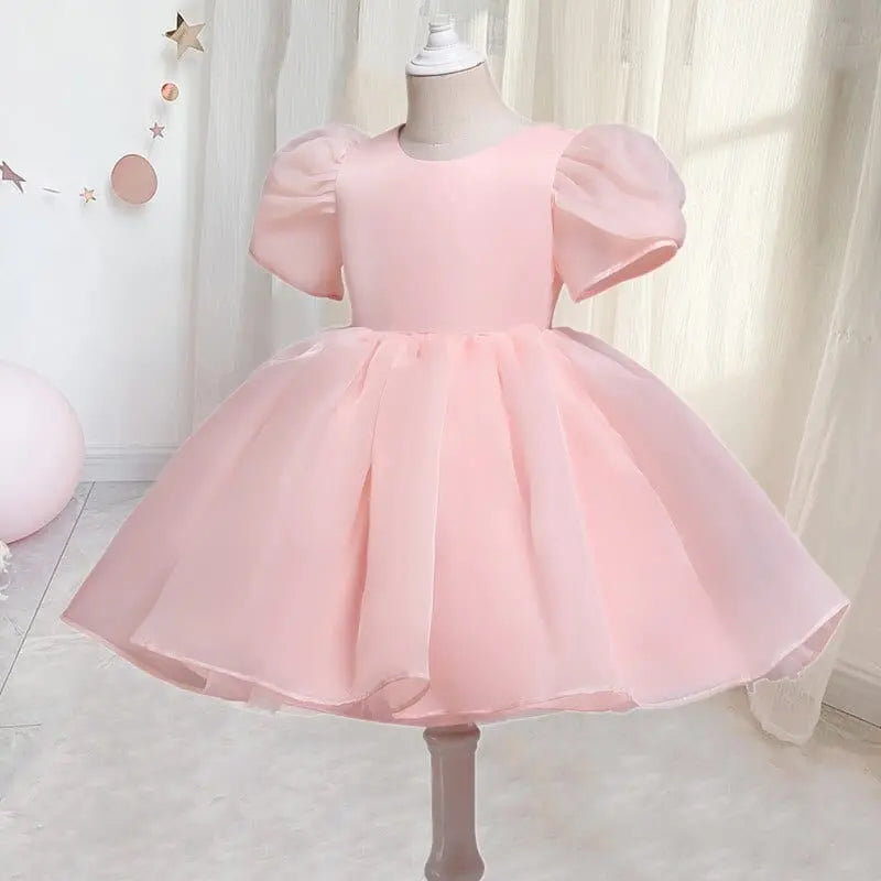 Elegant white tulle flower girl gown by Showlu Fashion Store, perfect for weddings, birthdays, and special occasions for kids.