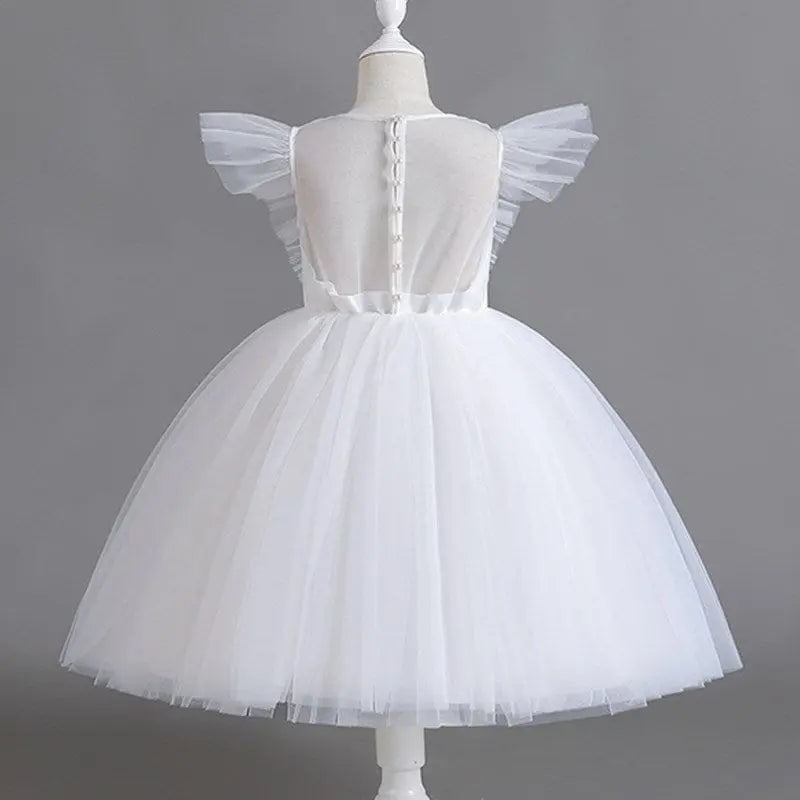 White tulle flower girl gown for kids, elegant fluffy dress for weddings, birthdays, and special occasions by Showlu Fashion.