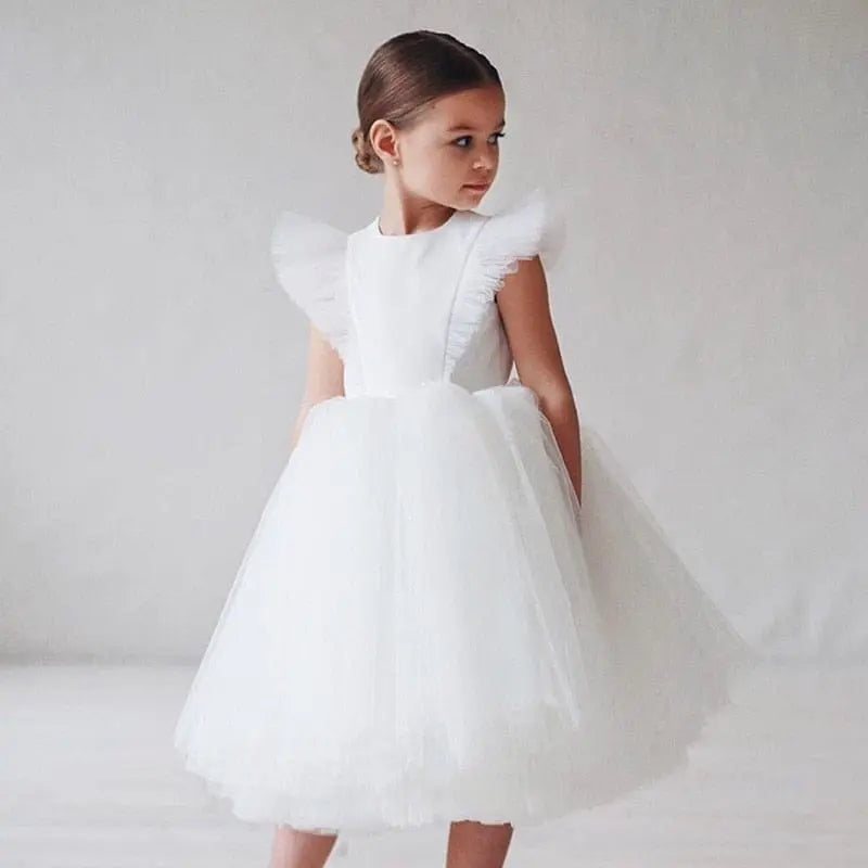 White tulle flower girl gown by Showlu Fashion Store, featuring a fluffy dress perfect for kids’ wedding, birthday, or communion.