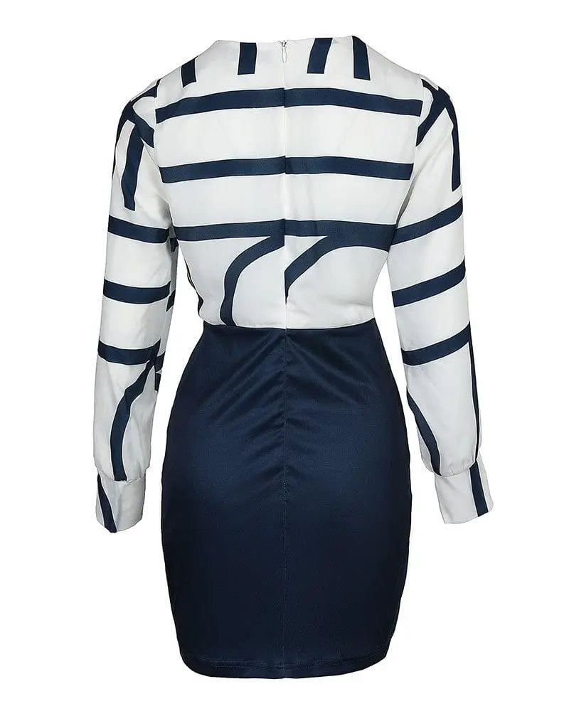 Slim-fit printed contrast color knee-length commuter dress by Showlu Fashion, featuring elegant design and stylish details.