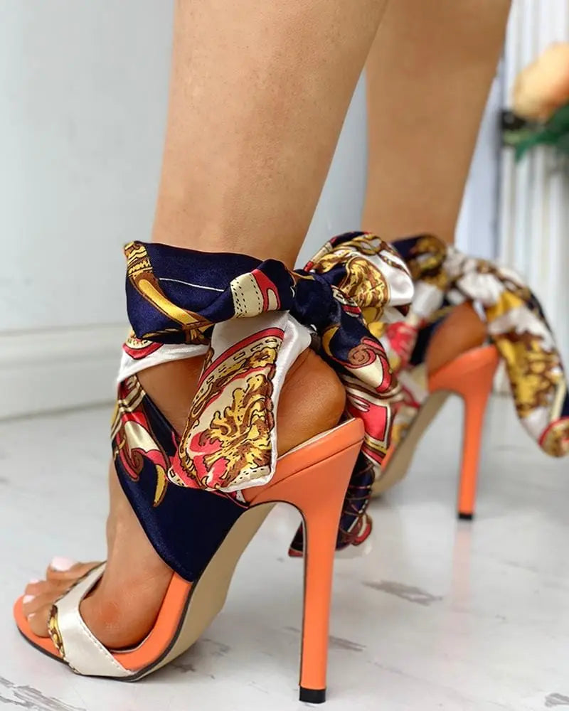 Showlu Fashion women's monogram stiletto heel bow bandage sandals with large-size design and elegant European-American style.