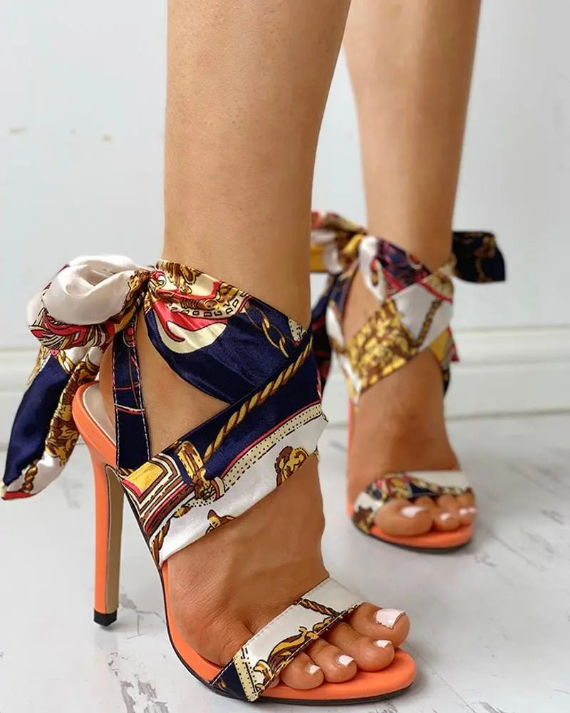 Showlu Fashion women's monogram stiletto heel bow bandage sandals with large size, European-American style, featuring a stylish design.
