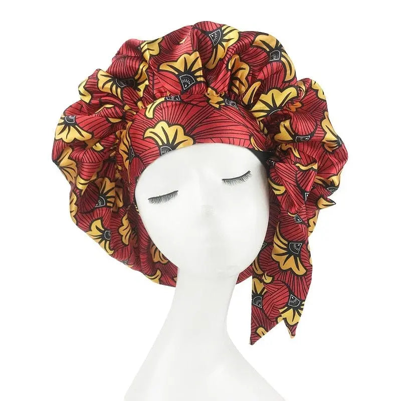 African print satin bonnet with adjustable wide band and elastic head wrap, designed for comfortable sleep and hair protection.