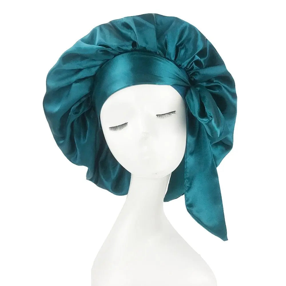 Showlu Store Nation African print satin bonnet with adjustable wide band and elastic head wrap for women’s sleep and hair protection.