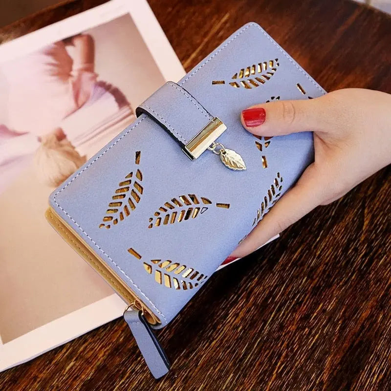 Showlu women's PU leather long wallet with gold hollow leaf design, featuring coin, card slots, and clutch-style purse in a sleek fashion.