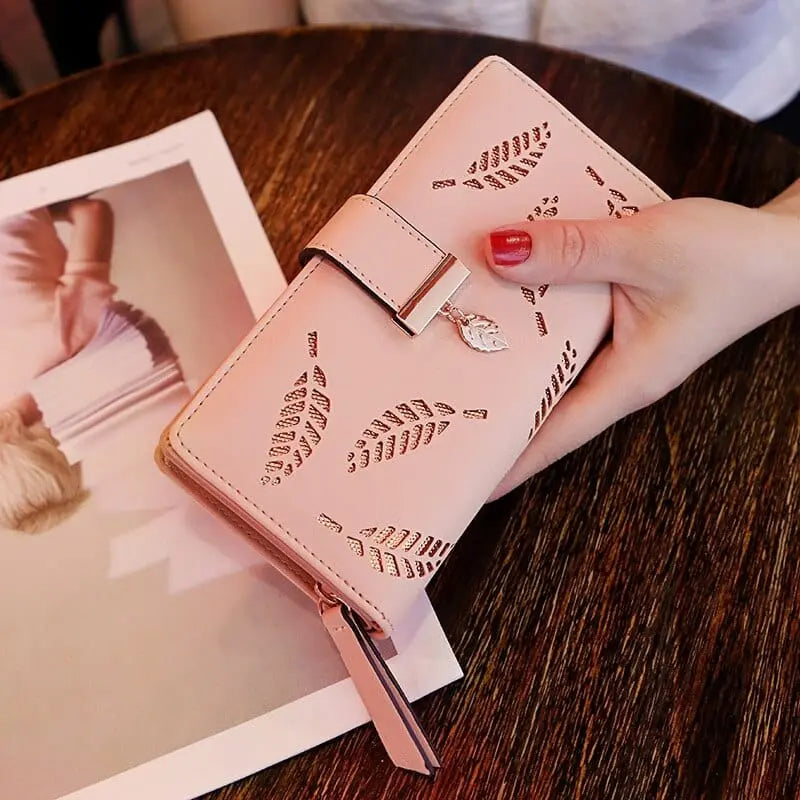 Showlu women's PU leather long wallet with gold hollow leaf design, featuring card slots and coin pouch, stylish clutch purse for women.