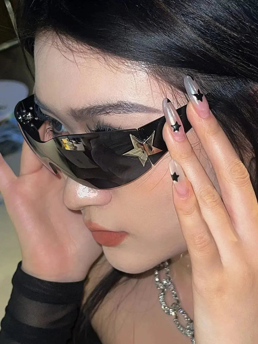 Orange frameless five-pointed star pilot sunglasses with trendy Y2K style, stylish all-in-one design for women.