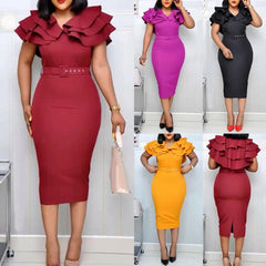 A woman models a solid color midi dress with a V-neck, ruffled sleeves, and a matching belt.